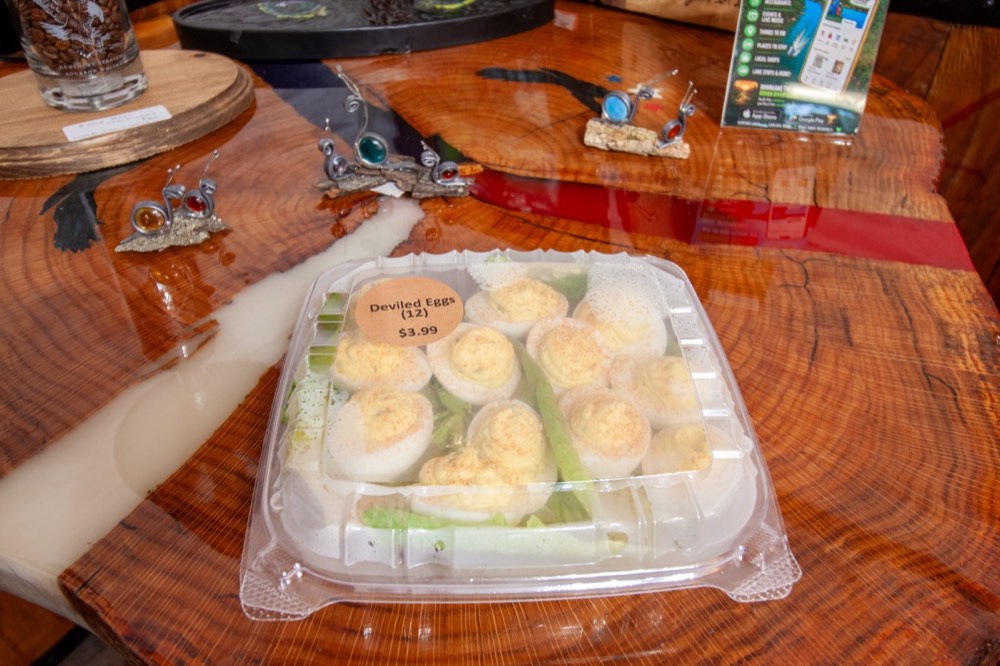 A dozen deviled eggs in a clear clamshell